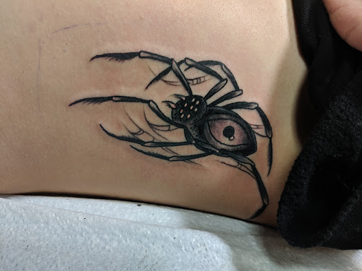 Explore back tattoo ideas for women, creative tattoo ideas in Newark, available at Rising Tide Tattoo Studio