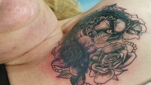 Explore massage therapy tattoo ideas, creative tattoo ideas in Lewiston, available at Professional Piercers of Maine
