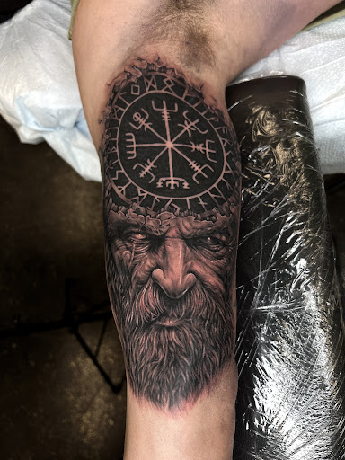 Explore back thigh tattoo ideas, creative tattoo ideas in Fairmont, available at Heretic Ink