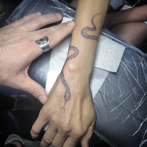 Explore bald head tattoo ideas, creative tattoo ideas in Los Angeles, available at Motis Tattoos