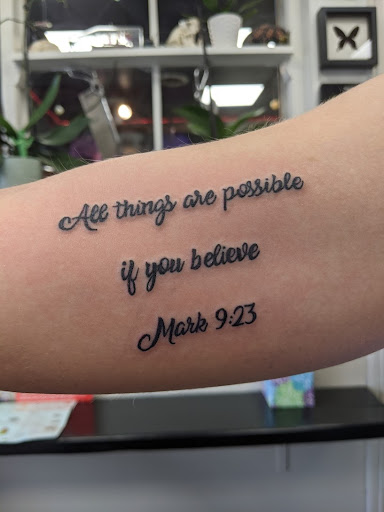 Explore kiss tattoo ideas, creative tattoo ideas in Slippery Rock, available at Dinky Dachshund Tattoo Parlor