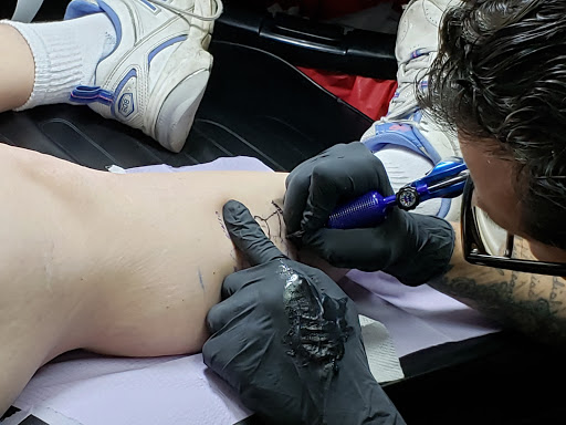 Explore dark cover up tattoo ideas, creative tattoo ideas in Largo, available at Alchemy Tattoos and Body Piercings