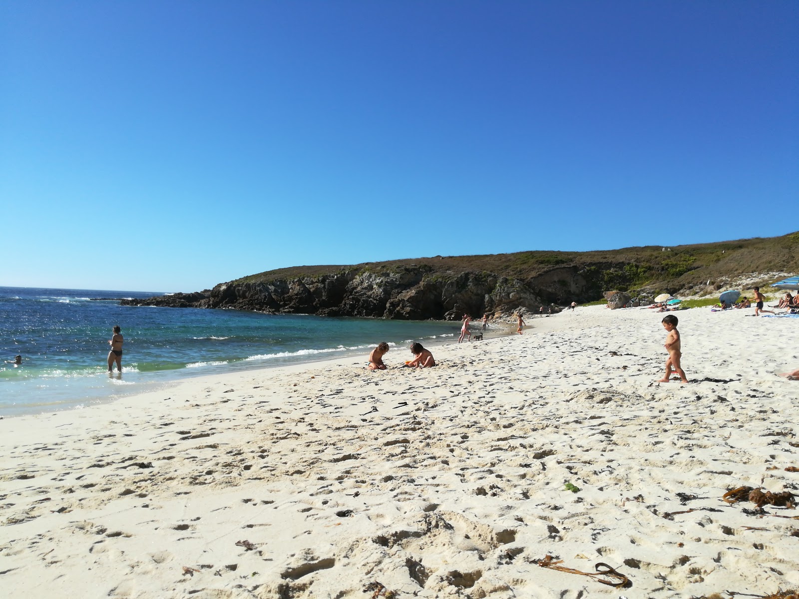 Foto de Playa de Arnado com areia bege superfície