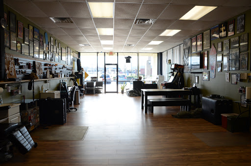 Tattoo Shop «Tattoo Machine Gun- Clark», reviews and photos, 1705 Charlestown New Albany Rd a, Jeffersonville, IN 47130, USA