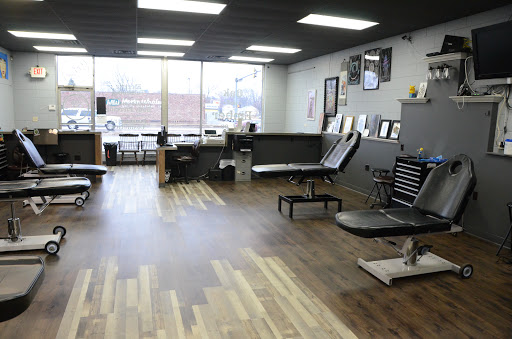 Explore lower back tattoo ideas for men, creative tattoo ideas in Bradley, available at Oak and Ember Tattoo