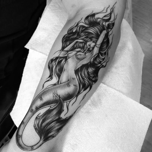 Explore k tattoo ideas, creative tattoo ideas in Ridge, available at Masquerade Tattoo Shop