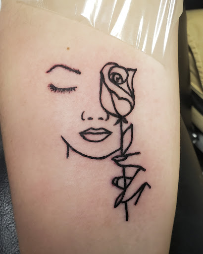 Explore color flower tattoo ideas, creative tattoo ideas in Erie, available at EliKingInk