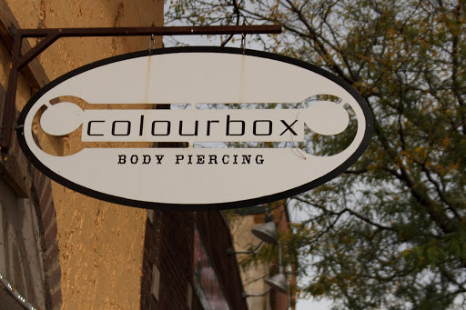 Explore wrap around tattoo ideas, creative tattoo ideas in Green Bay, available at Colourbox Body Piercing Llc