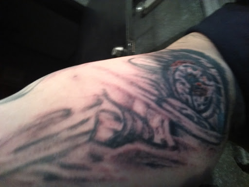 Explore crown tattoo ideas for guys, creative tattoo ideas in Sunbury, available at Axonic Inkworks Custom Tattoo Studio