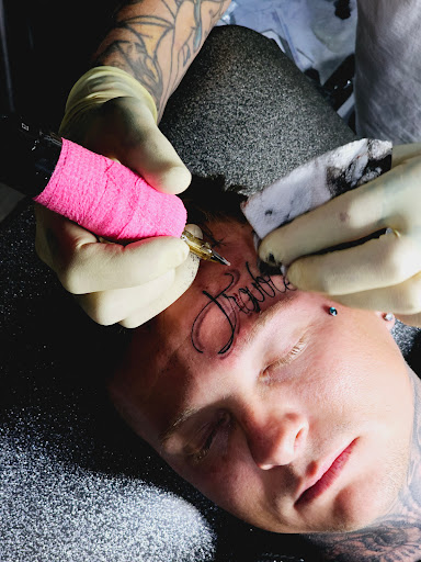 Explore snoopy tattoo ideas, creative tattoo ideas in Peoria, available at Iron Key Tattoo Studio Inc.