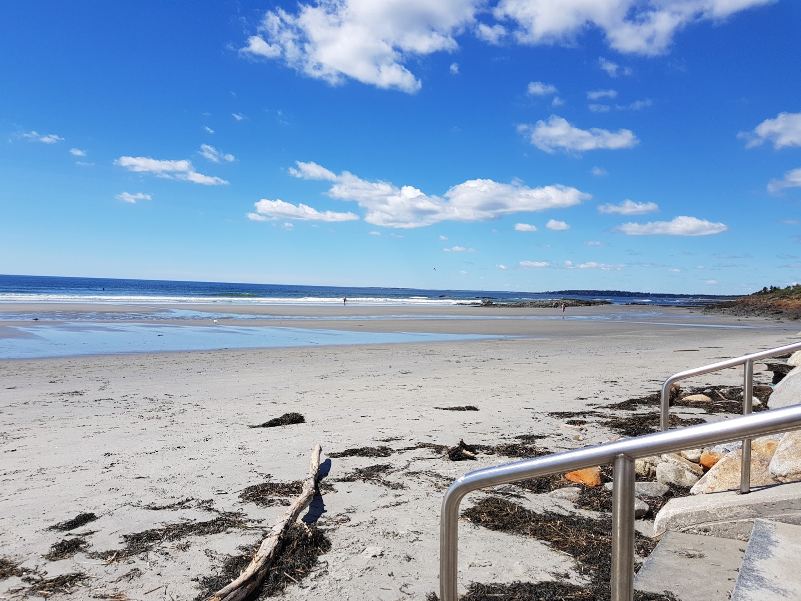 Foto av Higgins beach med beige sand yta
