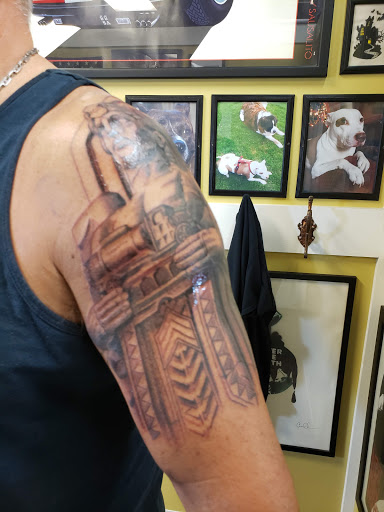 Explore boxer dog tattoo ideas, creative tattoo ideas in Cleveland, available at Stranci Tattoo & Piercing Co.