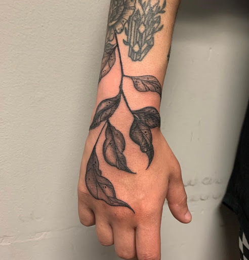 Explore rose thigh tattoo ideas, creative tattoo ideas in Chattanooga, available at Standard Ink Tattoo Co