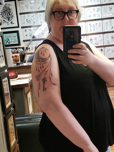 Explore inner bicep tattoo ideas, creative tattoo ideas in Glenside, available at Yellow Rose Tattoo