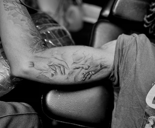 Explore silver lining tattoo ideas, creative tattoo ideas in Cincinnati, available at Artis Inks Tattoo - Clifton