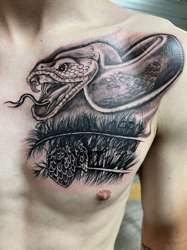 Explore back shoulder tattoo ideas for men, creative tattoo ideas in Spokane, available at Platinum Rose Tattoo Studio