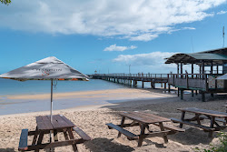 Foto di Kingfisher Bay Beach sorretto da scogliere