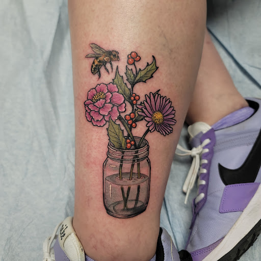 Explore tattoo ideas for women leg, creative tattoo ideas in Livonia, available at Integrity Tattoo Company