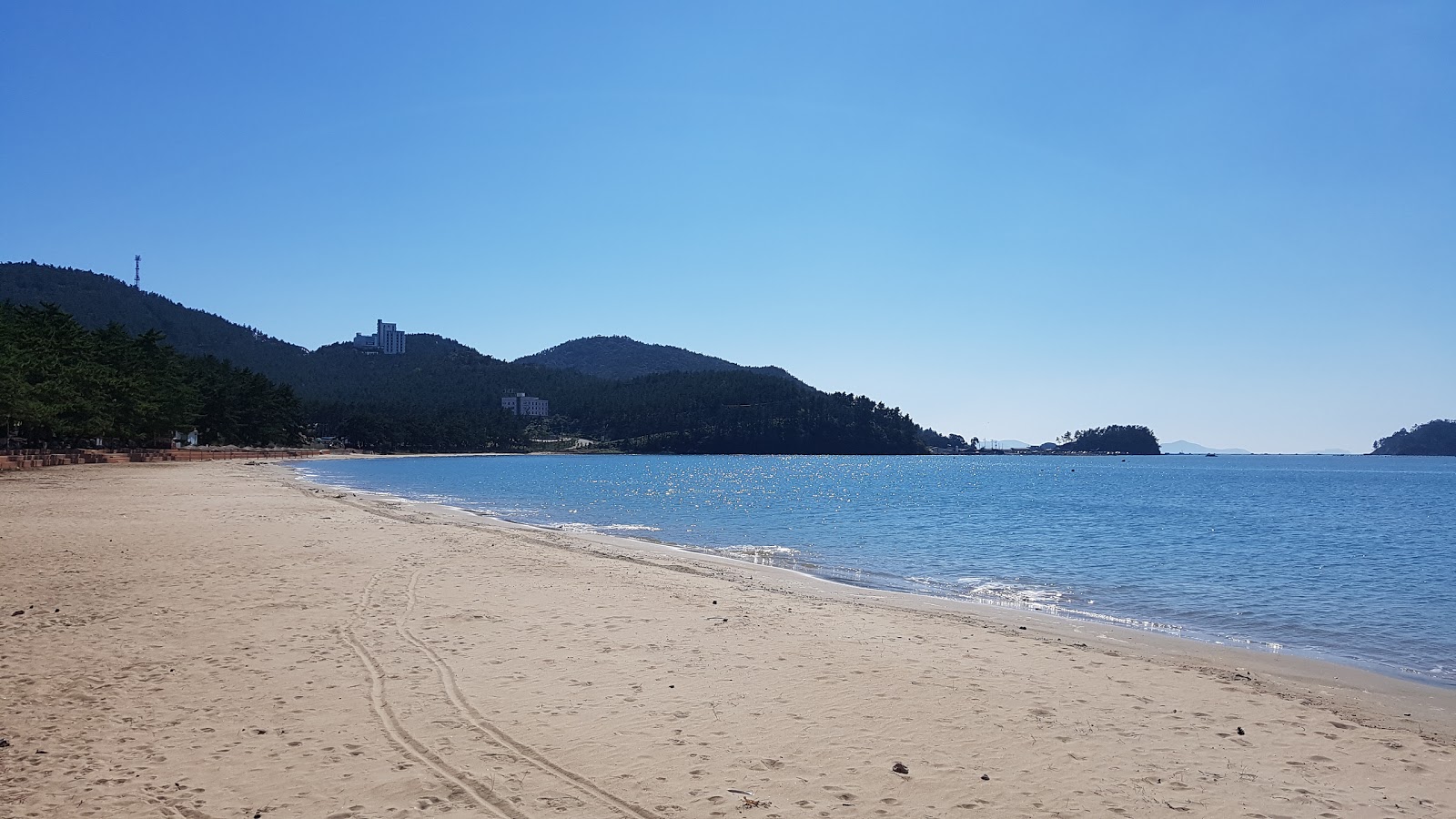 Zdjęcie Songho Beach z powierzchnią beżowy piasek