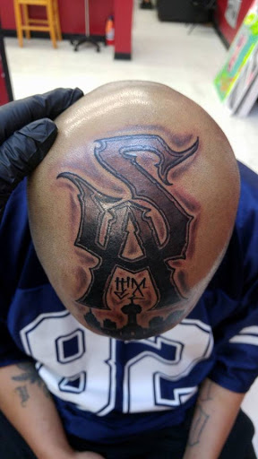 Explore red ink tattoo ideas, creative tattoo ideas in San Antonio, available at Nite Owl Tattoo Studio
