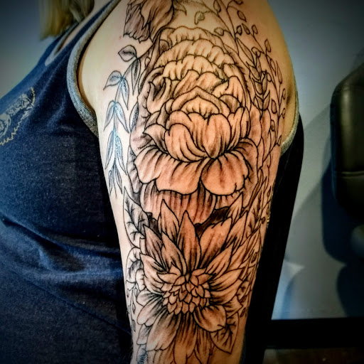 Explore mothman tattoo ideas, creative tattoo ideas in Bridgeport, available at Pike Street Studios Tattoo and Body Piercing