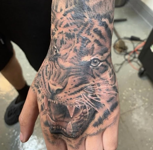 Explore black and red tattoo ideas, creative tattoo ideas in Arabi, available at Never Enough Tattoo & Body Piercing