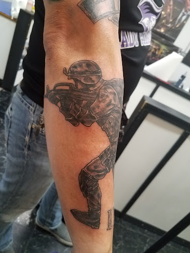 Explore december birth flower tattoo ideas, creative tattoo ideas in Rogers, available at Saved by Grace Tattoo Studio