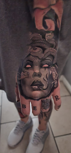 Explore mens western tattoo ideas, creative tattoo ideas in Ocoee, available at Slaughterized Ink Tattoo and Piercing Studio