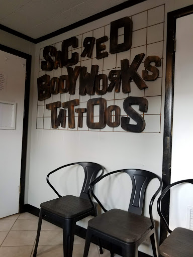 Explore red hand tattoo ideas, creative tattoo ideas in Massillon, available at Sacred Body Works Tattoo By appointment. Contact your artist for availability