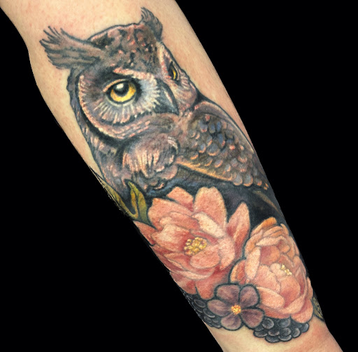 Explore knee cap tattoo ideas, creative tattoo ideas in Topeka, available at Looking Glass Tattoo & Gallery