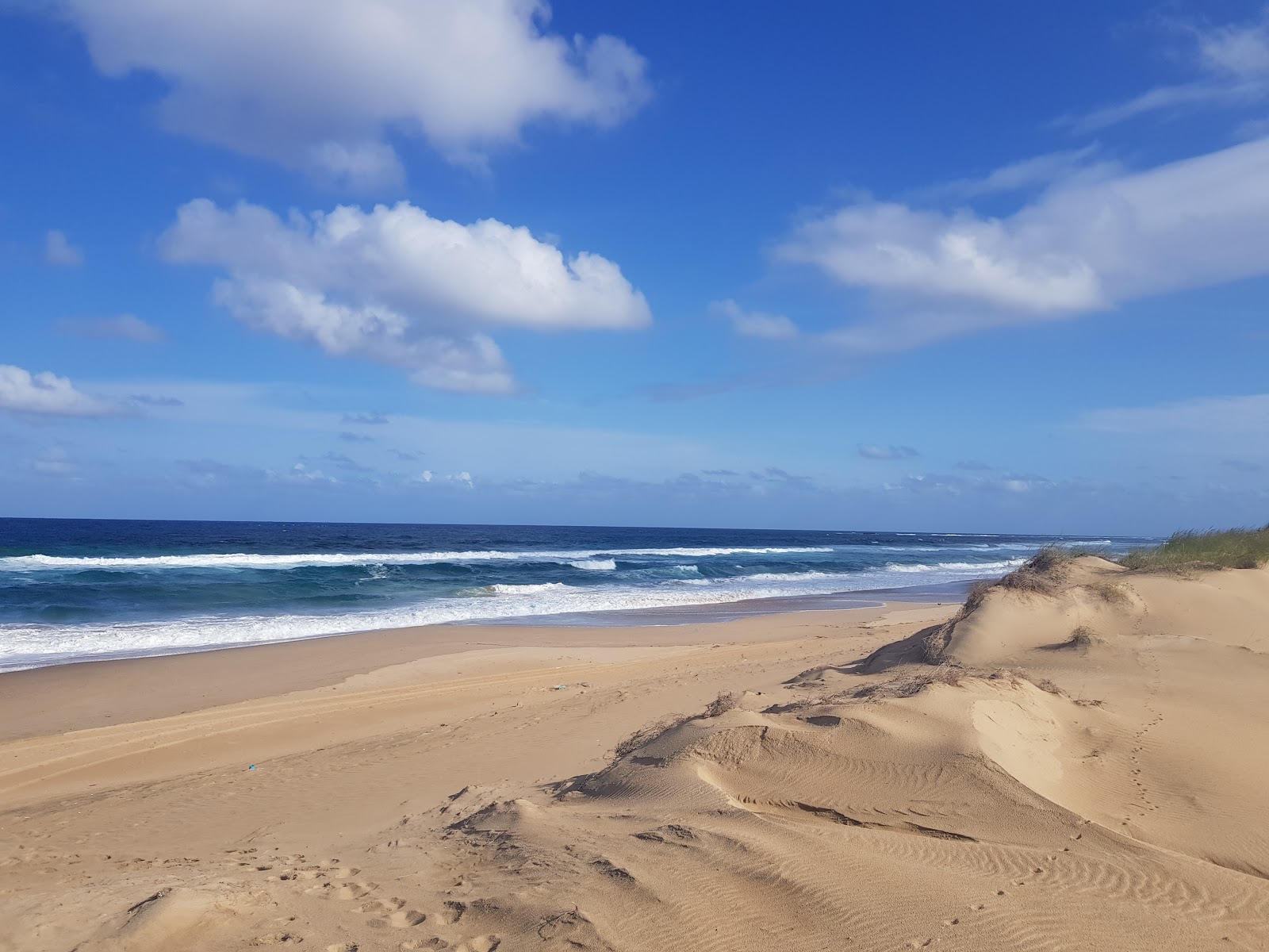 Photo de Praia de Jangamo II avec l'eau turquoise de surface