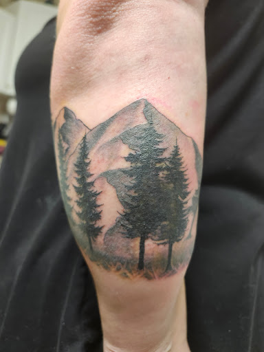 Find bracelet tattoo ideas for females for your next unique tattoo in Coeur D Alene at Jojos Tattoo & Body Piercing