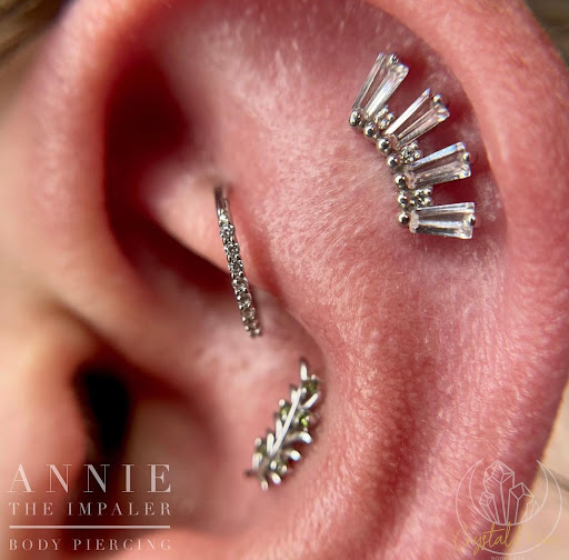 Explore rainbow baby tattoo ideas, creative tattoo ideas in Bloomington, available at Crystal Moon Body Arts