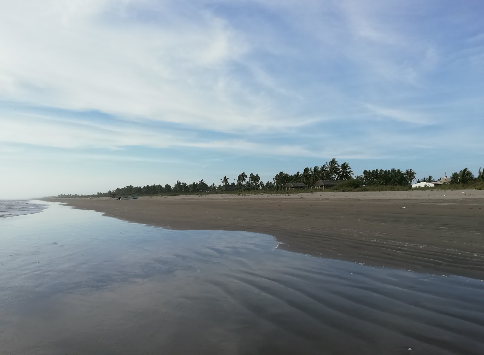 Fotografie cu La Puntilla beach cu o suprafață de nisip strălucitor