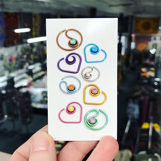 Explore neck tattoo ideas for women, creative tattoo ideas in Oswego, available at Bodified