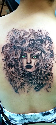 Explore neck tattoo ideas woman, creative tattoo ideas in Benton, available at Spectrum Tattoo