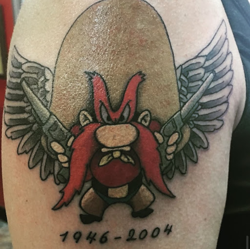 Explore country tattoo ideas for guys, creative tattoo ideas in Camden, available at The Golden Goose Tattoo Studio