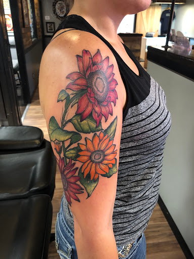 Find angel tattoo ideas for females for your next unique tattoo in Lees Summit at Bleeding Heart Tattoo