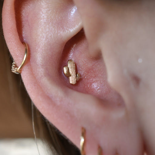 Explore black hole tattoo ideas, creative tattoo ideas in Reno, available at Black Hole Body Piercing