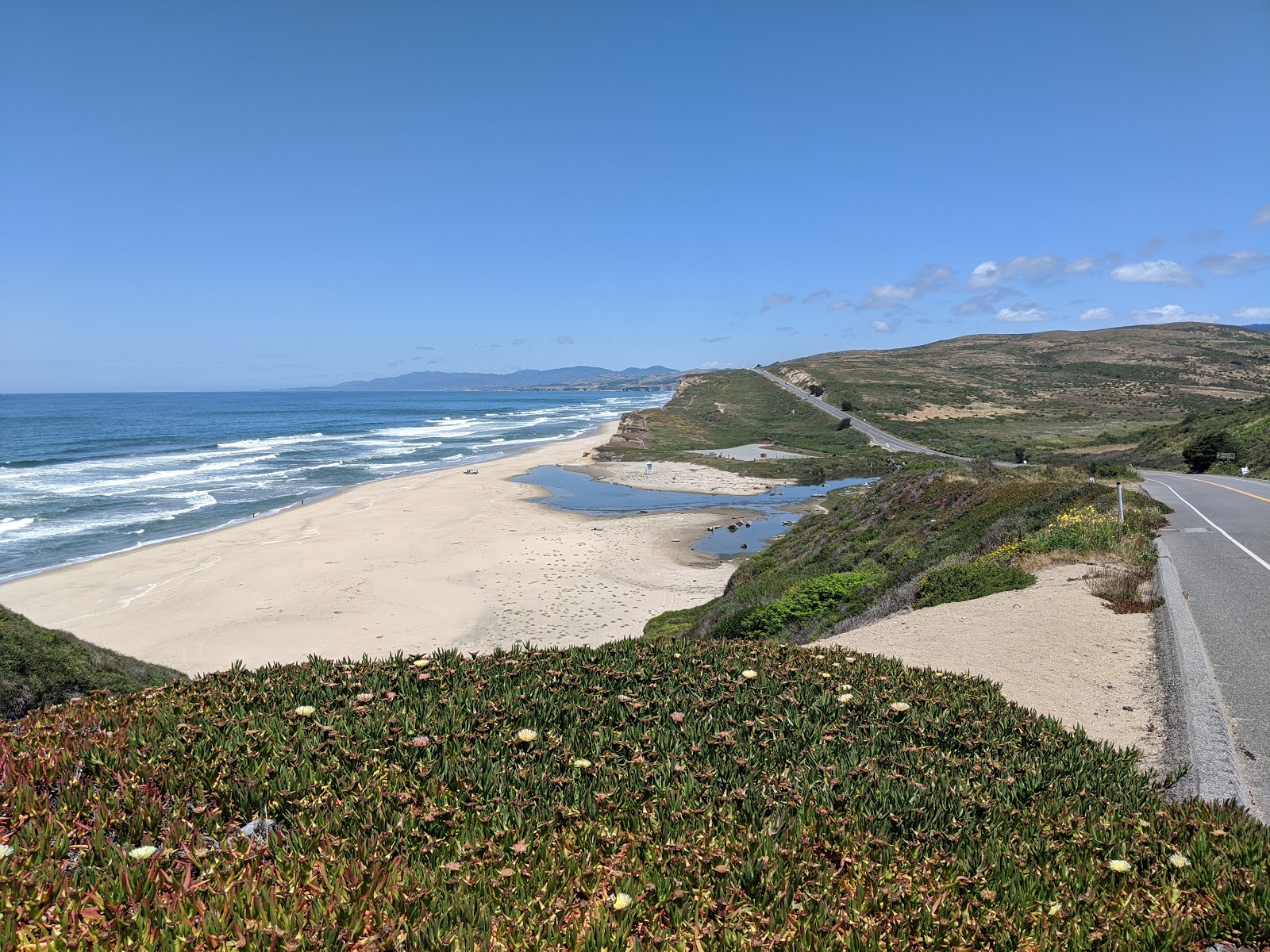 Photo of Pomponio Beach with turquoise water surface