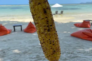 Fresh fruit and grilled corn on the cob image