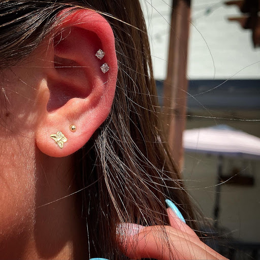 Explore coca cola tattoo ideas, creative tattoo ideas in Cary, available at Fine Art Body Piercing By Lilith Mae