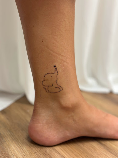 Explore rock tattoo ideas, creative tattoo ideas in Sarasota, available at Diamond Reigns Tattoos