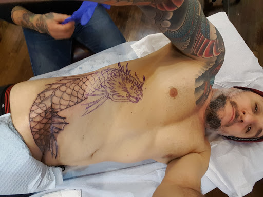 Explore religious tattoo ideas for guys, creative tattoo ideas in Chicago, available at Studio One Chicago