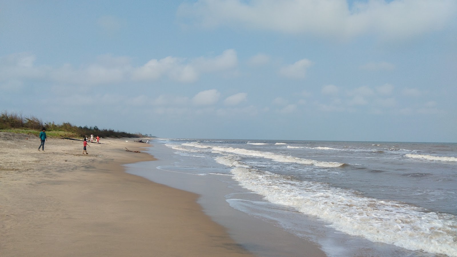 Foto di Turpupalem Beach con una superficie del sabbia beige fine