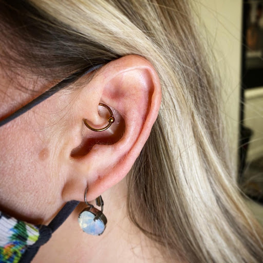 Explore gnome tattoo ideas, creative tattoo ideas in Louisburg, available at Purple Dot Piercings