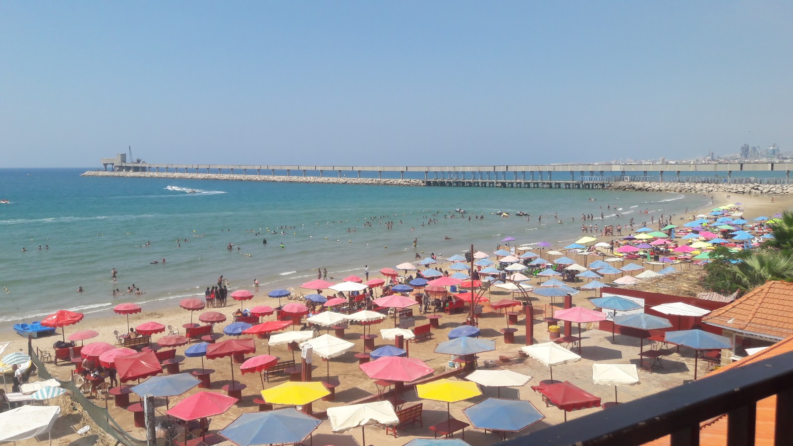 Photo of Sandy Beach and the settlement