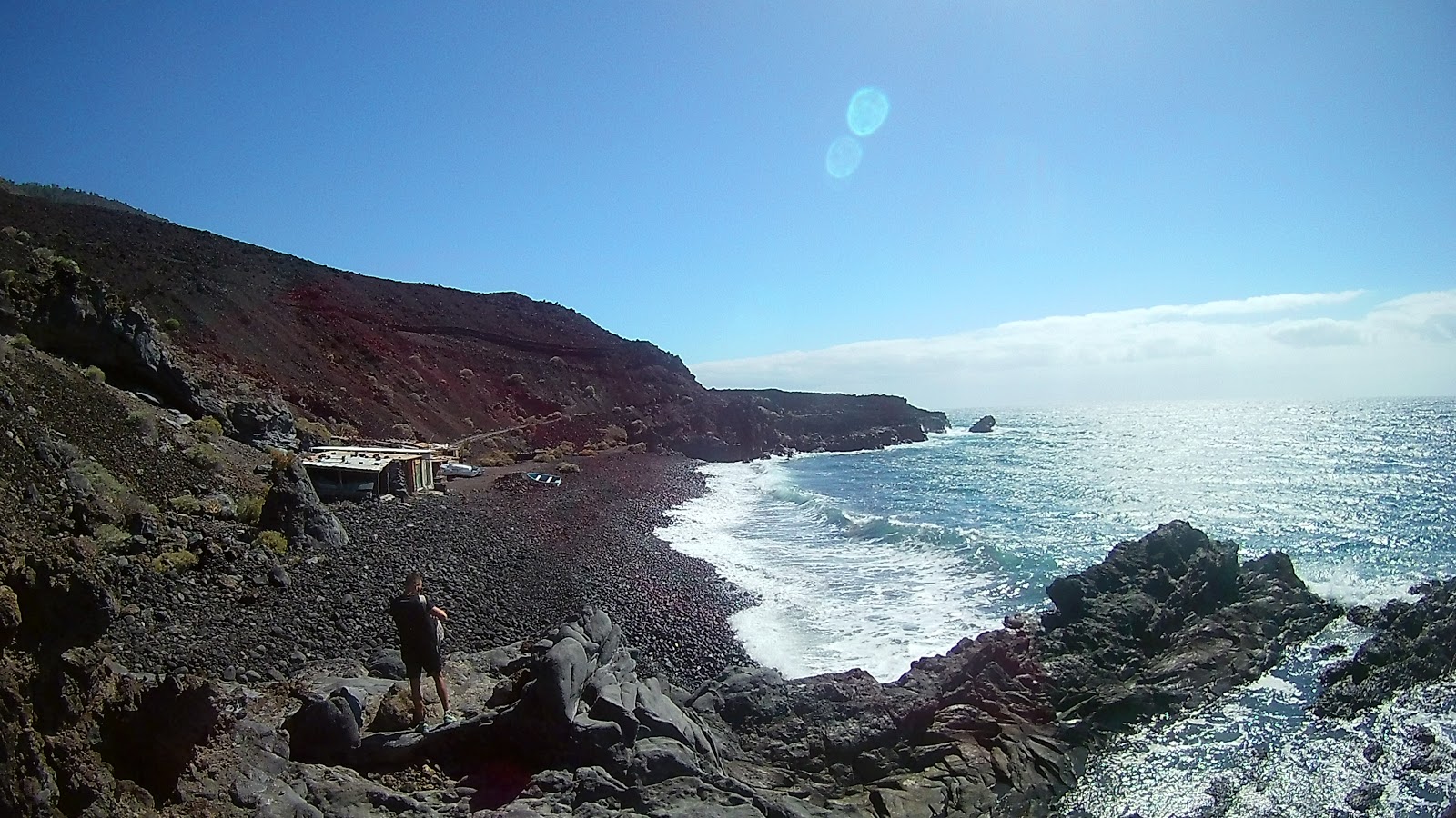 Foto av El Puertito med grå sten yta