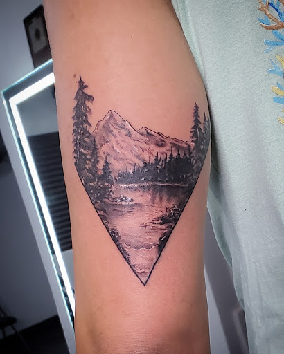 Explore long thin tattoo ideas, creative tattoo ideas in Debary, available at Divine Line Tattoos