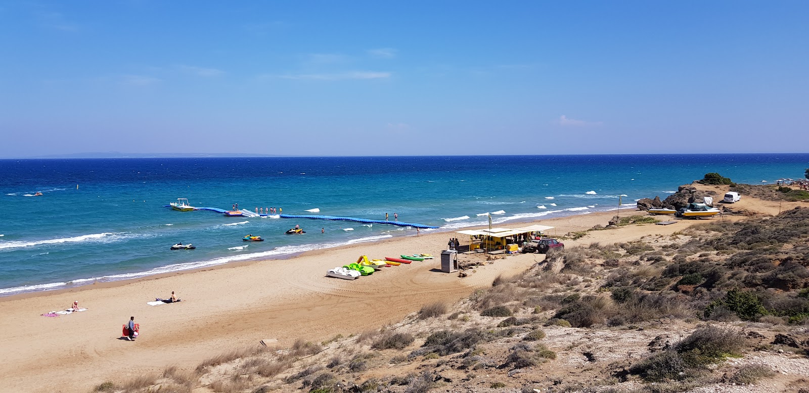 Zdjęcie Banana Beach z powierzchnią beżowy piasek